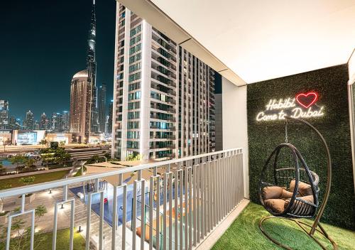 a balcony with a view of a city skyline at Stylish Burj khalifa view 5 Star 4BD Apartment in Downtown with Dubai Mall access - Brand New Apartment in Dubai