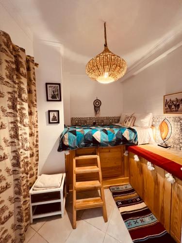 a room with a bunk bed and a bar at Art riad au bord de la mer 1 in El Jadida