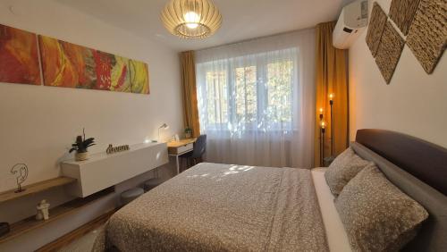 Ένα ή περισσότερα κρεβάτια σε δωμάτιο στο Tusmorez Central Apartment
