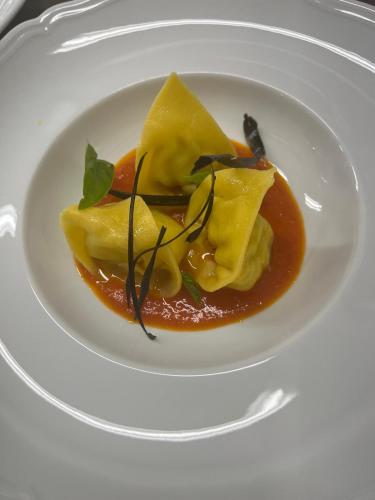 a plate of food on a white plate at Relais Osteria Dell'Orcia in Bagno Vignoni