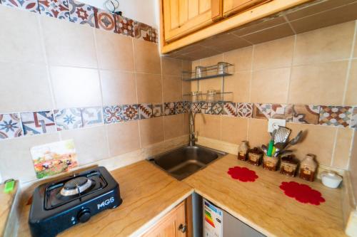 a kitchen with a sink and a counter top at Casa panorama in Chefchaouene
