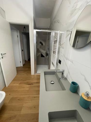 a bathroom with a sink and a mirror at Tiffany House in Marina di Massa