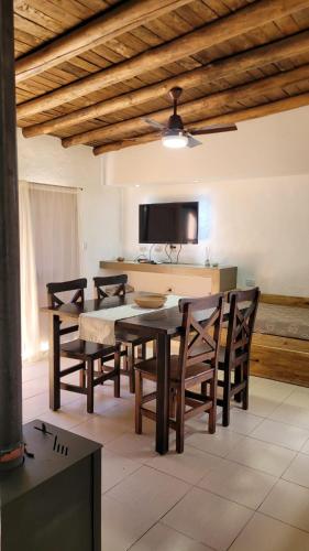 a dining room with a table and chairs at Complejo Atrapasueños in San Rafael