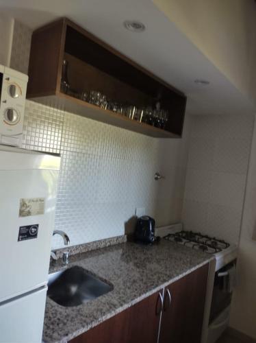 a kitchen with a sink and a counter top at Complejo Atrapasueños in San Rafael