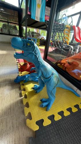 a toy dinosaur on a table in a store at Complejo Atrapasueños in San Rafael
