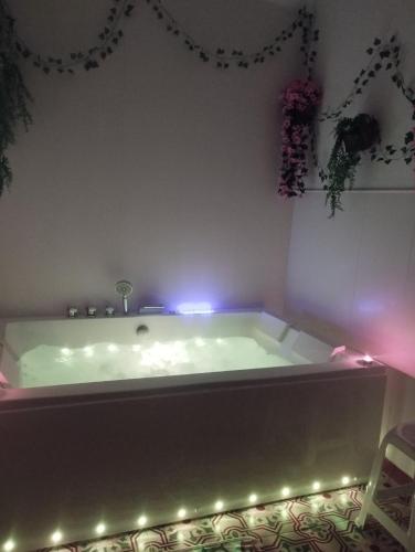 a bath tub with lights in a room at Casa Rural Majaceite in El Bosque