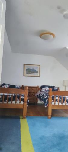 a bedroom with two bunk beds and a rug at Luxury house in Coldingham