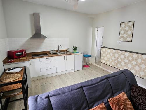 Kuchyň nebo kuchyňský kout v ubytování Apartamentos GARAKOTA
