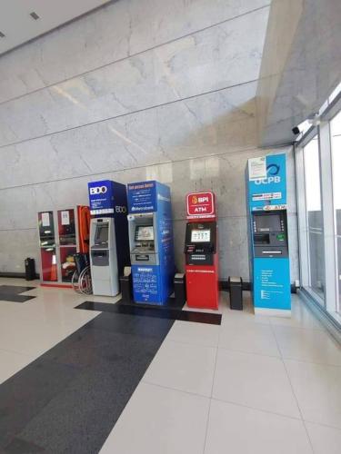 a row of gas pumps in a gas station at Budget friendly 1bedroom in The Mactan Newtown with pool&beach access in Punta Engaño