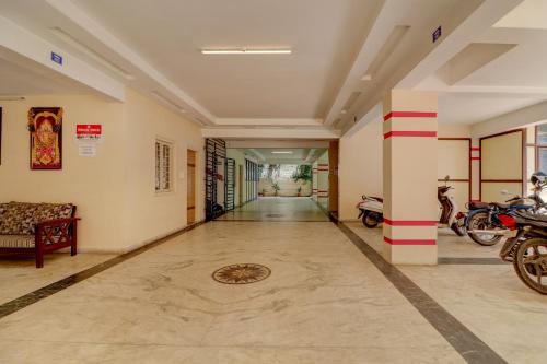 a hallway with motorcycles parked in a room at Homely 3BHK apartment in the heart of the city in Hyderabad