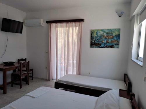 Katil atau katil-katil dalam bilik di Areti & Maria Apartments