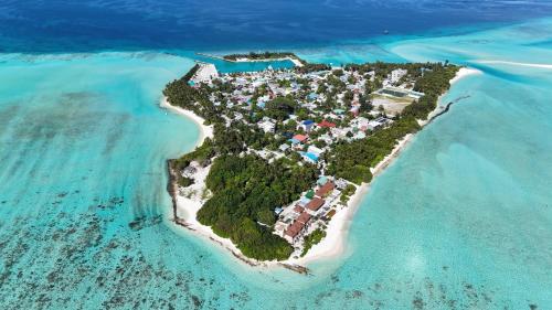 an island in the middle of the ocean at La Pearl Mathiveri in Mathiveri