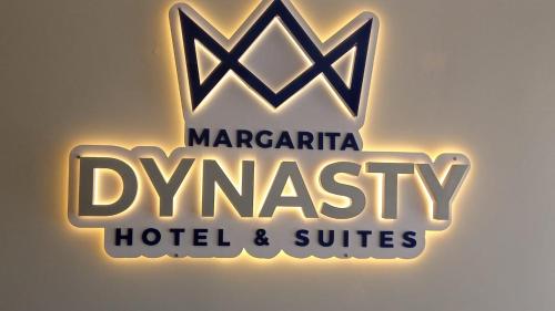 a sign for the margarita hygas hotel and suites at DYNASTY A002 in Porlamar