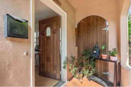an entrance to a house with a door and a television at 2BR Lit and Spacious in the Heart of Hollywood in Los Angeles
