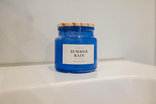 a blue jar of summer rain sitting on a counter at Chique Ibiza Zaandam in Zaandam