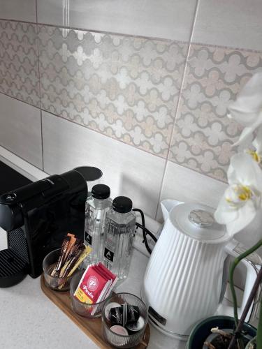 a kitchen counter with a counter top with a blender at EM House in Otopeni
