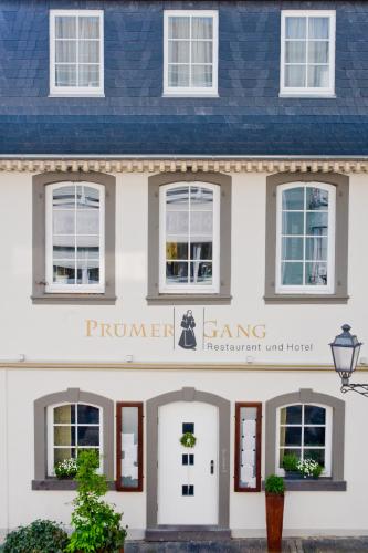 a rendering of the front of a white house at Prümer Gang Restaurant & Hotel in Bad Neuenahr-Ahrweiler