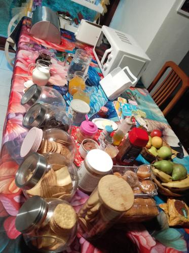 a table topped with lots of jars of food at Aitzkorri Zegama in Arrietas