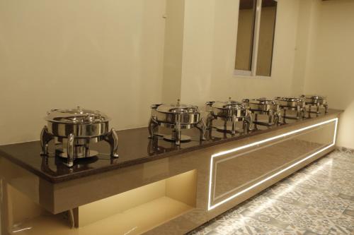 a row of drums on a counter in a room at The Blue Vista in Greater Noida