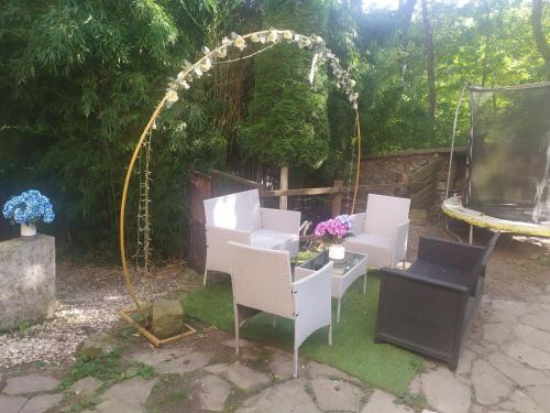 a group of white chairs and an arbor at Aitzkorri Zegama in Arrietas