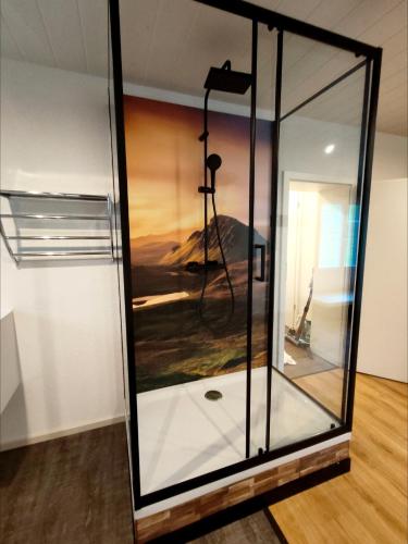 a glass box with a camera in a room at Chalet Wahida- Wellness Oase im Neckertal! in Sankt Peterzell