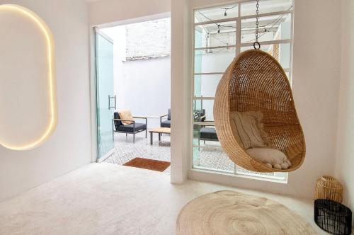 a hanging hammock in a room with a living room at Breathtaking house with patio in Roma Norte in Mexico City