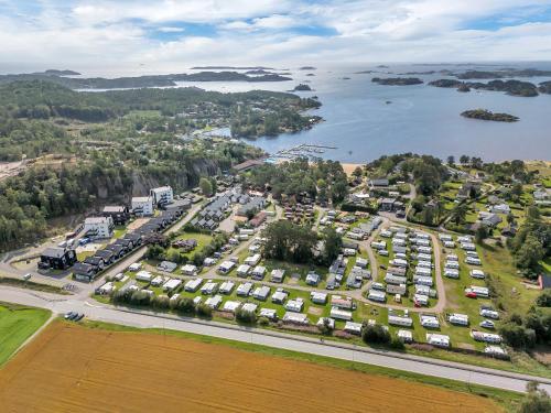 an aerial view of a parking lot next to a lake at Top Floor Apartment Årossanden 5 A in Kristiansand