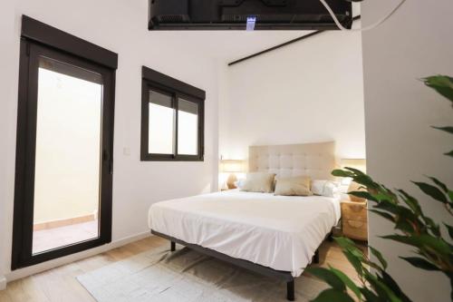 Ένα ή περισσότερα κρεβάτια σε δωμάτιο στο Hostal Roca 26