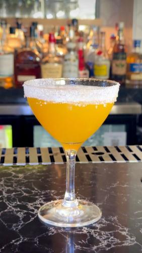 a drink in a glass sitting on a counter at Hilton Garden Inn San Juan Condado in San Juan