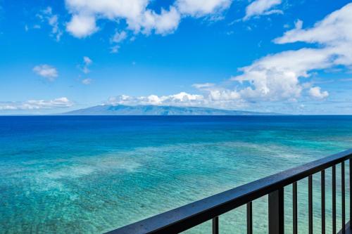 a view of the ocean from a balcony at Maui Kai 808 · MK 808 OceanFront 1BD Kaanapali Beach Ocean Views in Lahaina