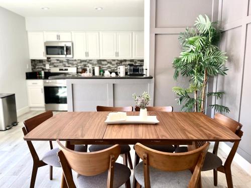 a dining room with a wooden table and chairs at NEW cozy beautiful house with pool and hot tub in Fair Oaks