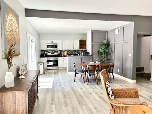 an open kitchen and dining room with a table and chairs at NEW cozy beautiful house with pool and hot tub in Fair Oaks