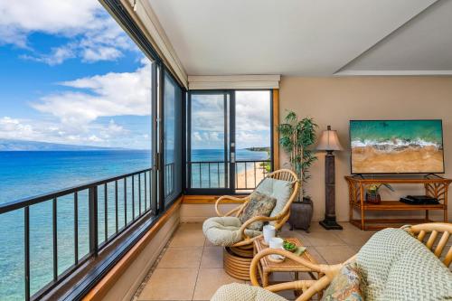 a living room with a view of the ocean at Maui Kai 808 · MK 808 OceanFront 1BD Kaanapali Beach Ocean Views in Lahaina