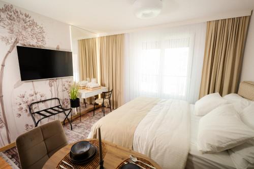 Ένα ή περισσότερα κρεβάτια σε δωμάτιο στο LUX apartmani Tuzla