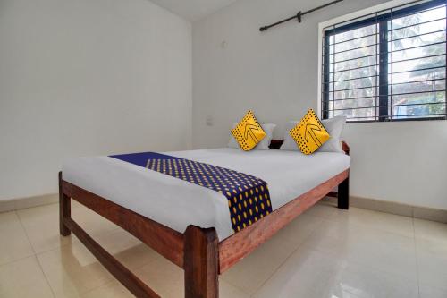 Postel nebo postele na pokoji v ubytování Hotel O U & I LIVINGS