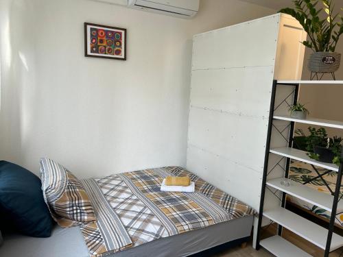 Una cama o camas en una habitación de Apartman Suncokret