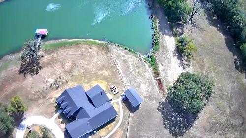 an aerial view of a house on an island next to the water at Double D Guest Cottage in Emory