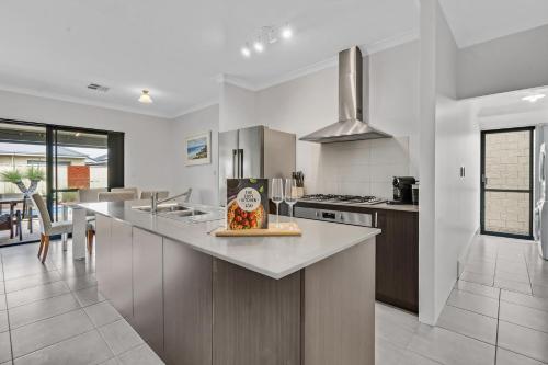 a kitchen with a counter and a stove top oven at Cooinda Happy Place 3BR Home with Pool in Eaton