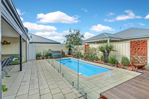 a swimming pool in the backyard of a home at Cooinda Happy Place 3BR Home with Pool in Eaton