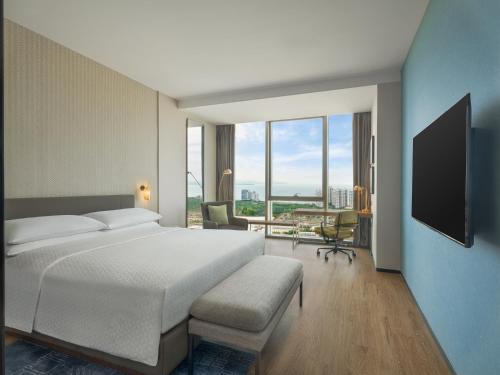 Four Points by Sheraton Yantaiにあるベッド