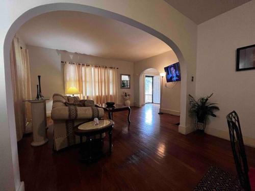 a living room with a couch and a table at Comfortable 2-Bdrm Spacious Home with Wifi & Patio in Indianapolis