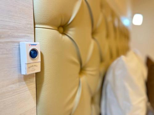 a camera on the wall of a hotel room at AKS Hotel in Tashkent
