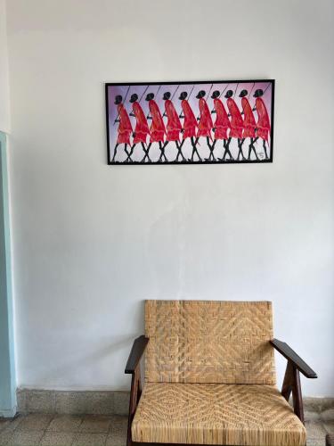 a picture of red birds on a wall at Ijen Haus in Banyuwangi