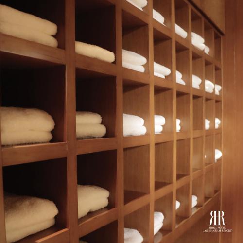 a closet filled with lots of white towels at RIHGA Royal Laguna Guam Resort in Tamuning