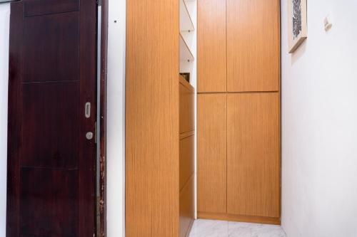 an open door in a room with a closet at Homestay Syariah Bayt in Pekalongan