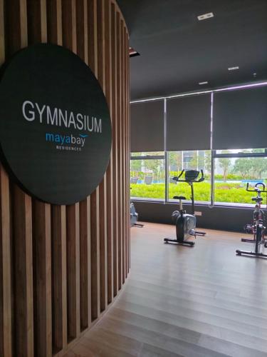 a gym with a large sign on a wall at Village Vibes at Splashmania Gamuda Cove in Pulau Kempas