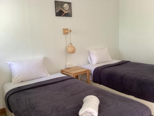 Postel nebo postele na pokoji v ubytování Namthip Homebeach