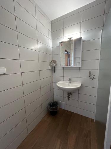 a bathroom with a sink and a mirror at Motel R10 in Mladá Boleslav