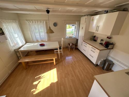 a small kitchen with a table and a small table in a room at Mandauhaus Großschönau in Großschönau