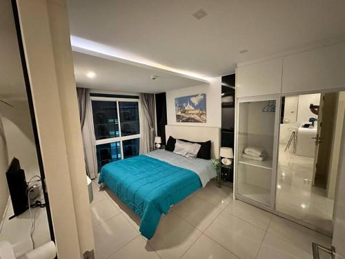 En eller flere senge i et værelse på City Center Residence Pattaya